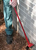 Photo of Terminix service technician performing trenching method.